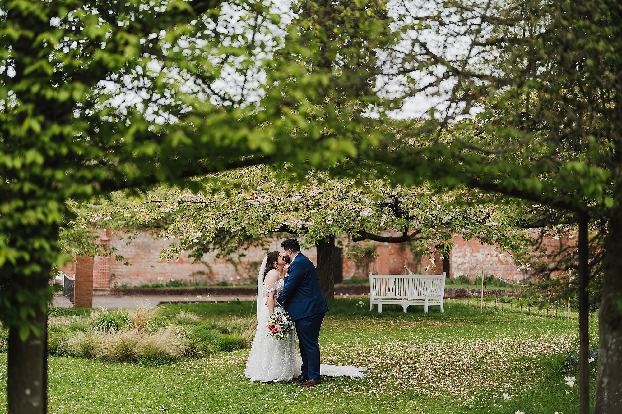 Couple giggling in the walled gardens at Combermere Abbey Cheshire Venue